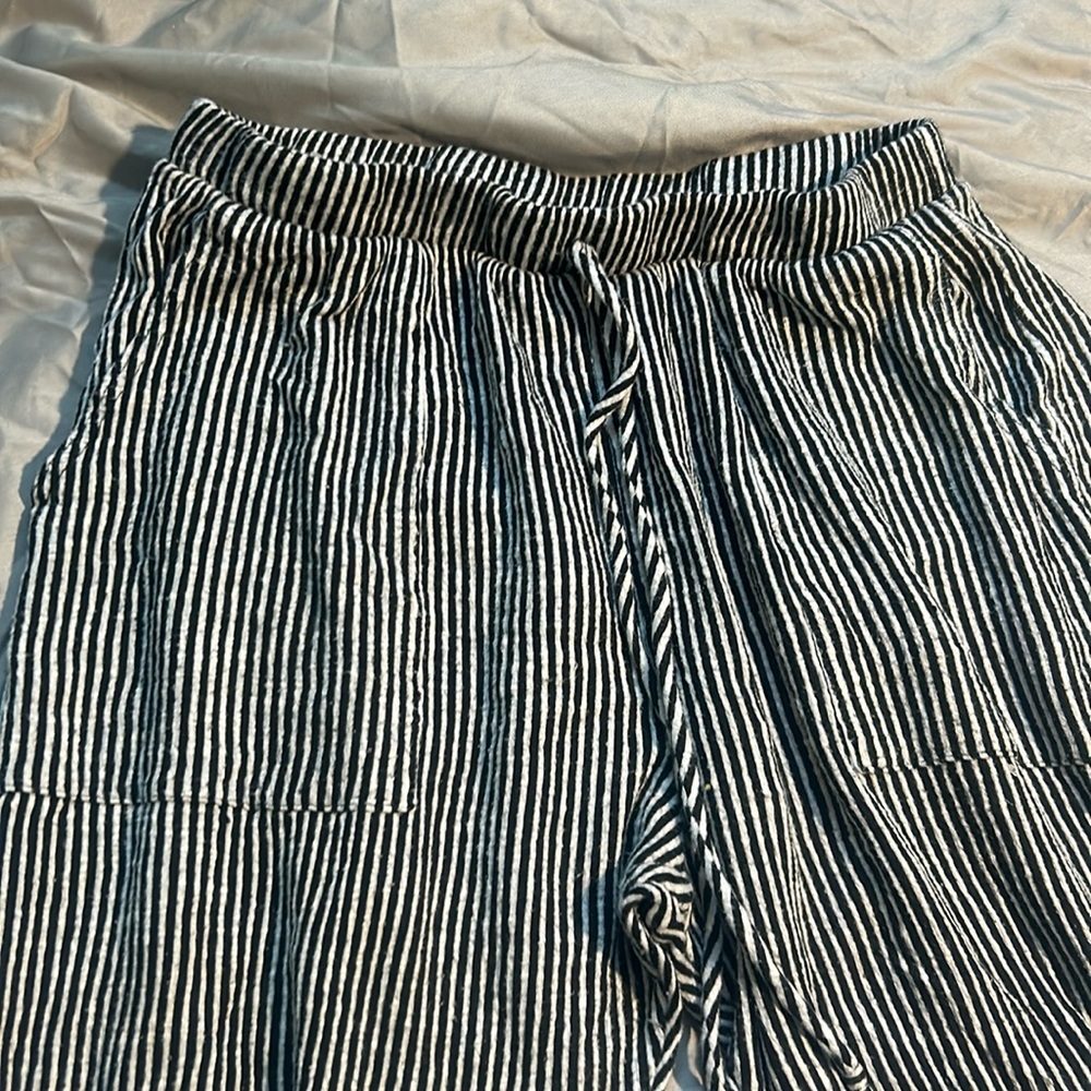 Black and white striped pants.
